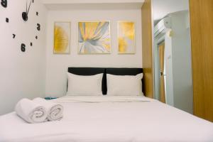 Cozy Studio at Urbantown Serpong Apartment By Travelio