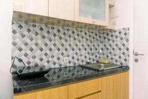 Cozy Studio at Urbantown Serpong Apartment By Travelio