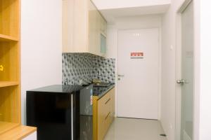 Cozy Studio at Urbantown Serpong Apartment By Travelio