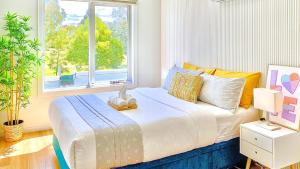 Modern Family Oasis - 4BR, Free Parking, Steps to Shops & Train