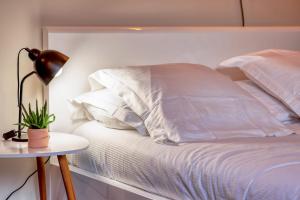 Appartements Deborah studio calme lit et place de parking : photos des chambres
