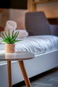 Appartements Deborah studio calme lit et place de parking : photos des chambres