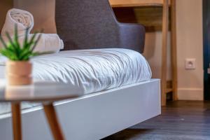 Appartements Deborah studio calme lit et place de parking : photos des chambres