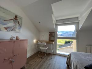 Appartements Maison des Fleurs T2 COSY : photos des chambres