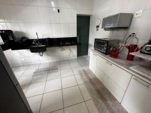 Casa na praia de Bertioga com Pscina e Churrasqueira - até 10 Pessoas