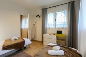Appartements La chute des feuilles - 2 Lits simples - T2 Hyper centre : photos des chambres