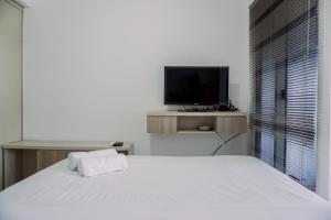 Restful and Homey Studio Apartment M-Town Residence By Travelio