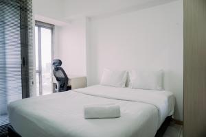 Restful and Homey Studio Apartment M-Town Residence By Travelio