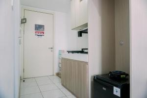 Restful and Homey Studio Apartment M-Town Residence By Travelio