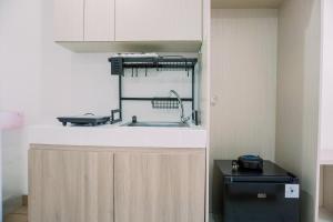 Restful and Homey Studio Apartment M-Town Residence By Travelio