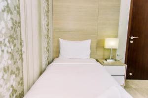 Comfy and Elegant 2BR at Menteng Park Apartment By Travelio