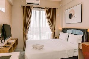 Well Design and Comfy Studio at Sky House BSD Apartment By Travelio