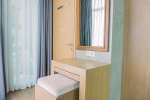 Spacious and Homey 2BR at Tree Park City Cikokol Apartment By Travelio