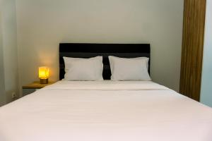 Nice and Elegant 2BR Apartment at Springhill Terrace Residence By Travelio