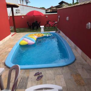Casa para temporada em condomínio Orla 500, com piscina em unamar - Cabo Frio