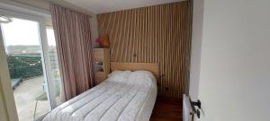 Gelijkvloers vakantie-appartement met groot zonnig terras