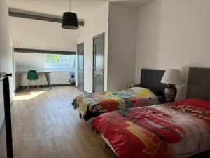 Appartements Duplex 2 chambres proche tram : photos des chambres