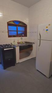 Casa Condomínio Ubatuba com churrasqueira privativa