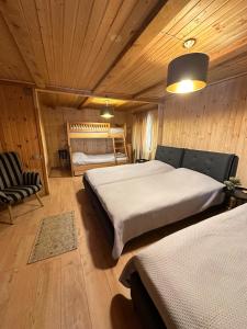 კოტეჯი ბახმაროში WoodenHouse Sunrise