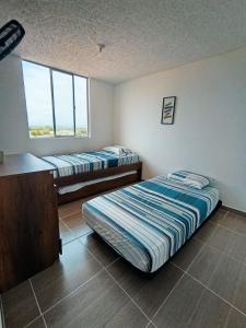 Apartamento con piscina a 10 minutos de Melgar y Girardot- canchas de futbol- voleiball playa - parque y mas