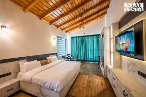 StayVista at Sunset Springs with Heated Swimming Pool