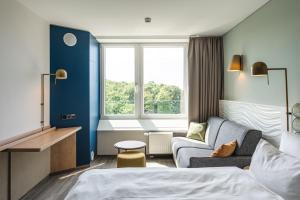Deluxe Double Room with Side Sea View room in aja Warnemünde