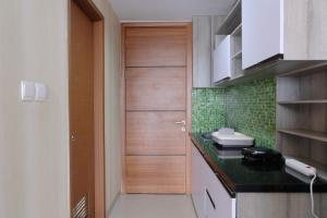 Modern Designed and Strategic Studio Room at Beverly Dago Apartment By Travelio