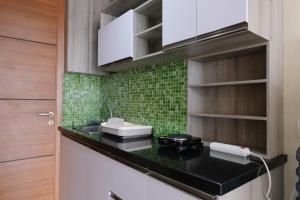 Modern Designed and Strategic Studio Room at Beverly Dago Apartment By Travelio