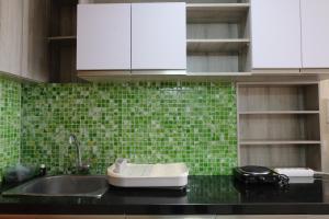 Modern Designed and Strategic Studio Room at Beverly Dago Apartment By Travelio