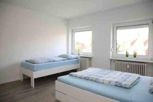 Moderne Wohnung mit Balkon, Küche, Garten Smart-TV