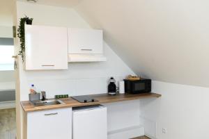 Appartements TC Residences - Charmant Appartement : photos des chambres