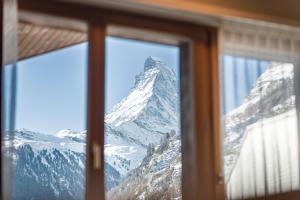 Double Room with Balcony and Matterhorn View room in Hotel Parnass
