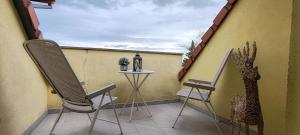 Appartements Au coeur des vignes : photos des chambres