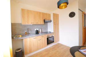 Appartements Le Neo - Studio chic avec sa cour privative et fibre : photos des chambres