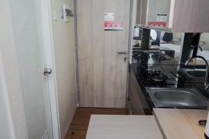 Modern Look Studio Akasa Pure Living BSD Apartment By Travelio