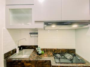 Cozy Studio Apartment at Transpark Cibubur By Travelio