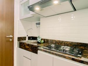 Cozy Studio Apartment at Transpark Cibubur By Travelio