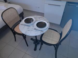 Appartements Studio Cosy 15 m2 au fond du jardin : photos des chambres