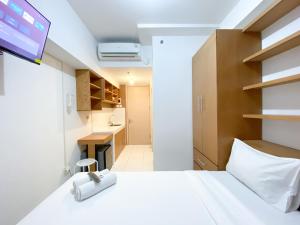 Cozy Studio Room at Tokyo Riverside PIK 2 Apartment By Travelio
