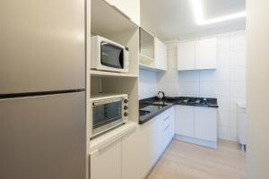 Apto a VISTA MAR 150m PRAIA Cozinha completa CHURRASQUEIRA AR CONDICIONADO Wi-Fi e vaga privativa de garagem Reserve agora mesmo