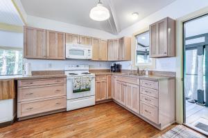 Torch Lake Getaway with Private Beach and Boat Dock!