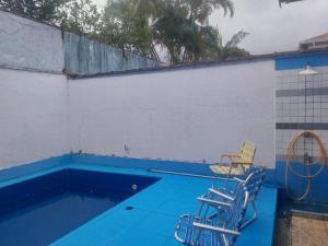 Casa com Piscina para Temporada com 3 quartos - Jardim Real - Praia Grande