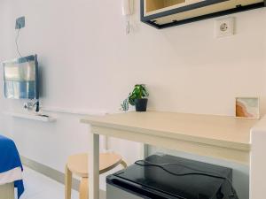Simply and Restful Studio at Tokyo Riverside PIK 2 Apartment By Travelio