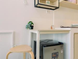 Simply and Restful Studio at Tokyo Riverside PIK 2 Apartment By Travelio