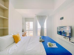 Simply and Restful Studio at Tokyo Riverside PIK 2 Apartment By Travelio