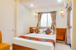 FabHotel Rising Surya - Nr Embassy Tech Zone