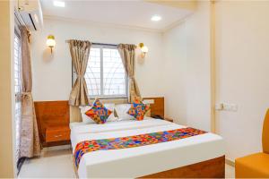 FabHotel Rising Surya - Nr Embassy Tech Zone