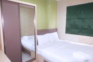 Best Price 2BR Green Pramuka City Apartment By Travelio