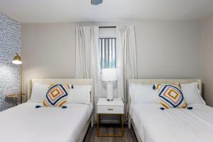 Modern 2BR Escape with Pool & Free Parking