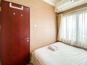 Signature 2BR at Apartment Tamansari Panoramic By Travelio